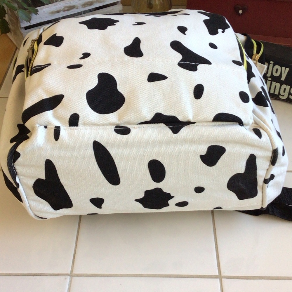‘Living Traveling Share’ Canvas Cow Print Backpack - Picture 7 of 8